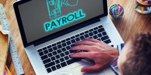 payroll laptop hands 