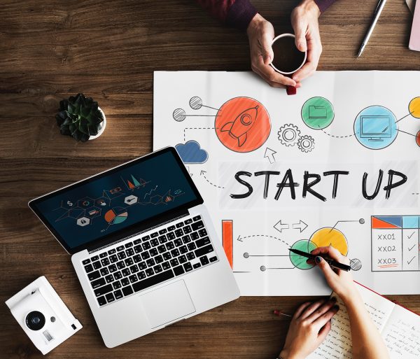 meeting on a table discussing on launching a startup business